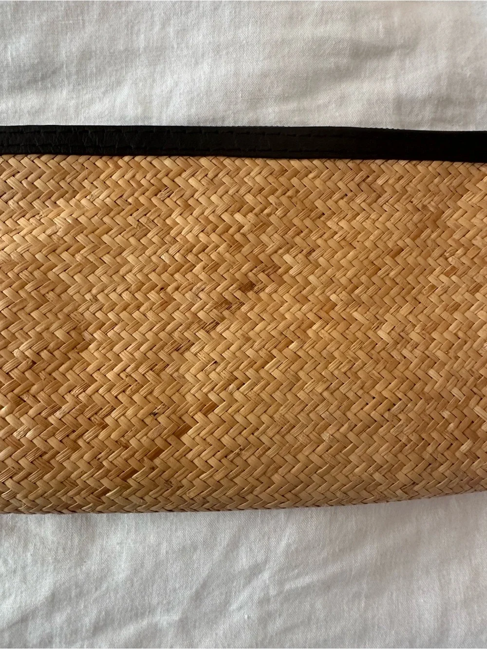 Rattan clutch with pompom zip